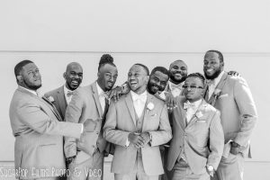 wedding groomsmen laughing