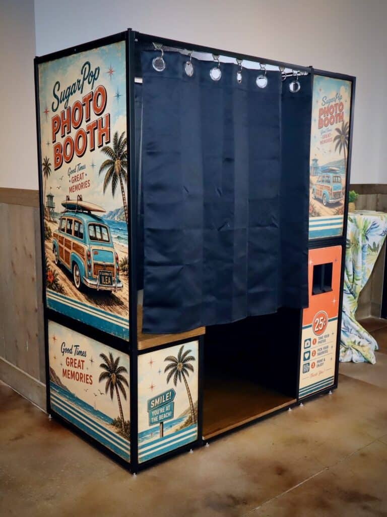 Enclosed photo booth with a navy curtain and distressed beach wrap