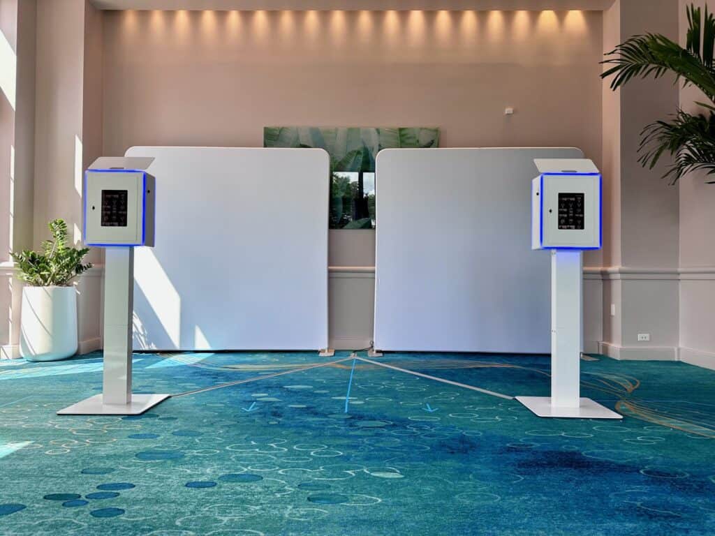 Two SugarPop AI photo booths set up at the Walt Disney World Swan Hotel for the Elevate leadership conference